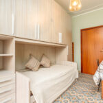 311_4643_ZONA_GIORNO_CON_I_DUE_LETTI_UN_NEL_CASSETTONE_ESTRAIBILE_BORGHETTO_SANTO_SPIRITO